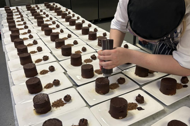 chef preparing rows of desserts