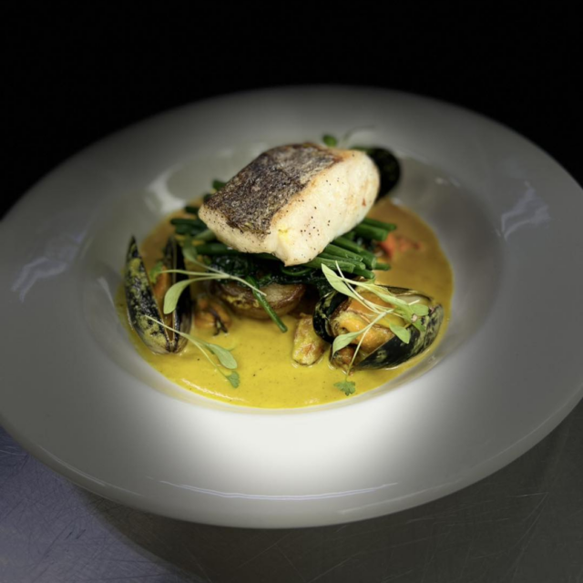 food displayed elegantly on a white plate