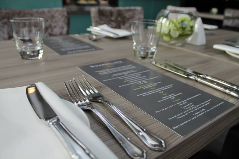 table setting for meal with menu