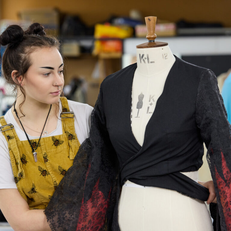 fashion student working on garment