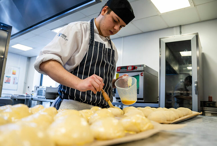 A student preparing food in The Wharncliffe kitchen