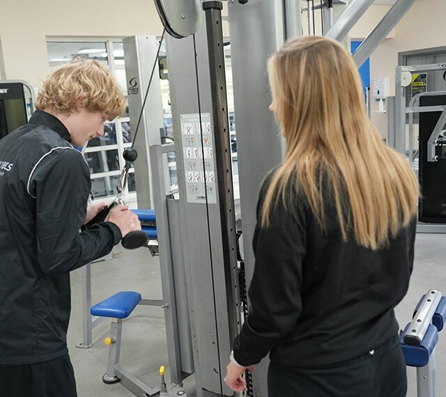 People using the weights in the DVC Sports gym